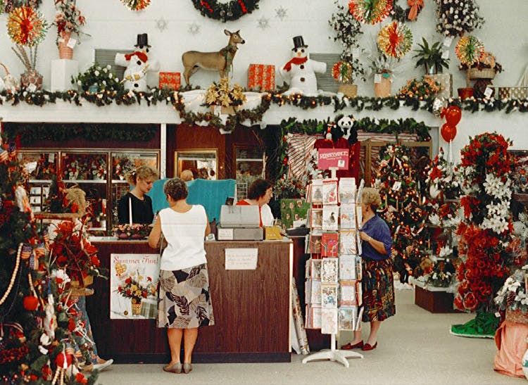 Christmas decorations abound in this early '90s holiday snapshot of the showroom floor