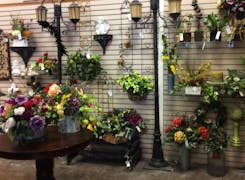 A wide range of colorful floral arrangements, awaiting their new home